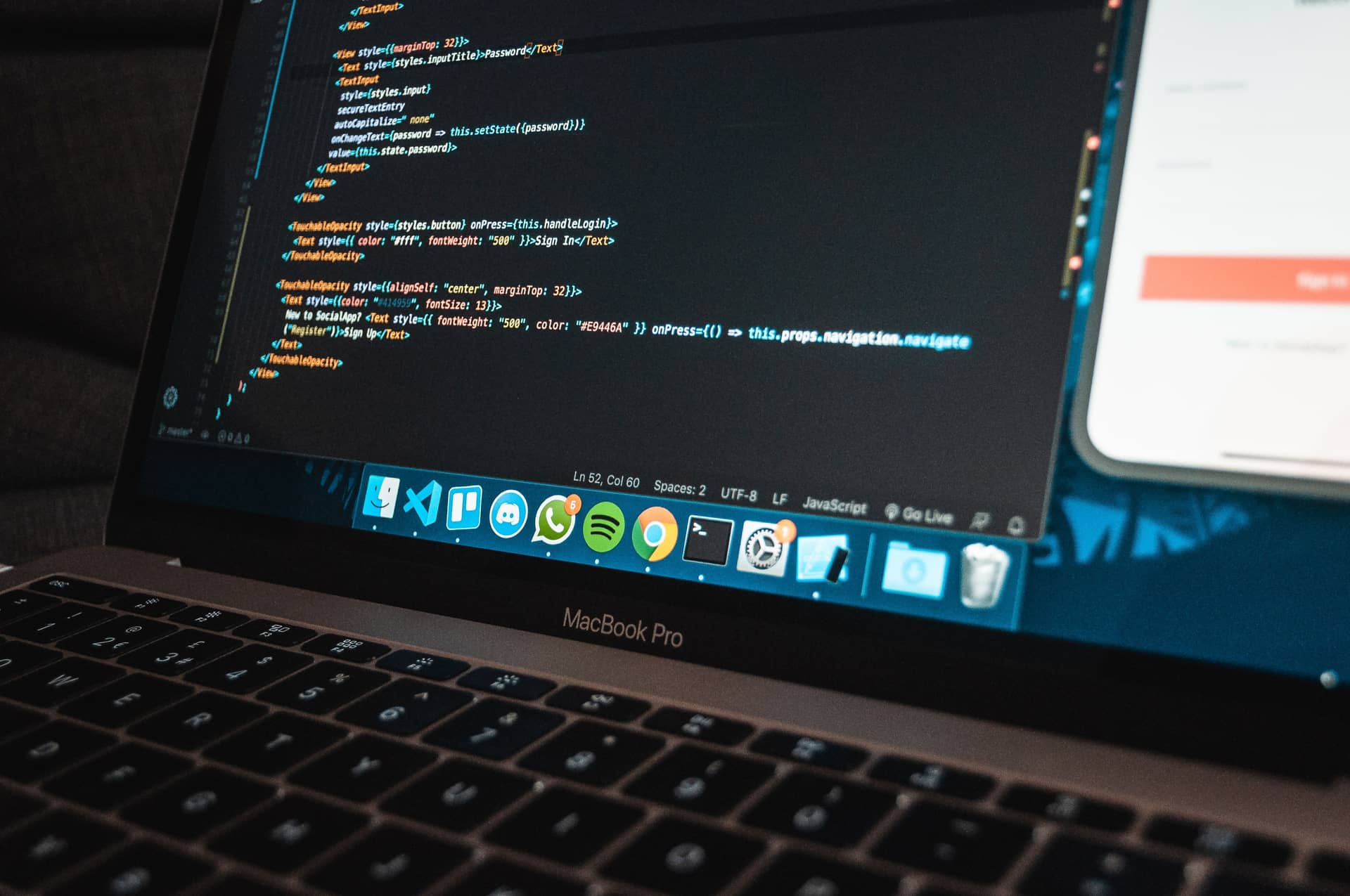 Visual Studio Code open on a React Native authentication screen